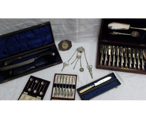 A white metal and antler handled carving set, (cased), together with a silver desk clock,a continental white metal chatelain,
