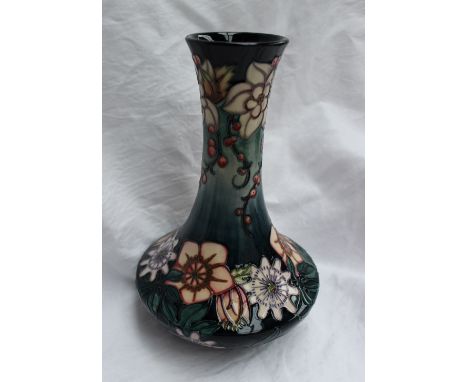 A modern Moorcroft carousel pattern vase with a tapering neck and squat body, impressed mark, signed R J Bishop No.182 dated 