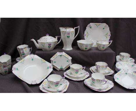 A Shelley part tea set decorated with garden flowers, including a large bowl, plate, teapot, teapot stand, hot water jug, cre