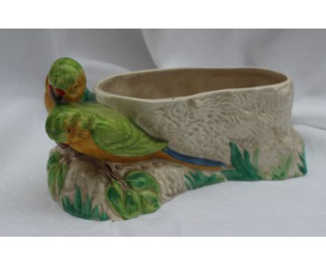 A Clarice Cliff Budgerigar vase, of oval form with two budgerigars on a rocky base, 28cm long together with another moulded C