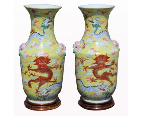 (2) Chinese Qing Dynasty Porcelain Dragon Vases.  Depicting dragons chasing flaming pearls throughout exterior.  Mounted to w