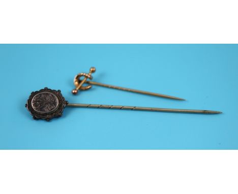 Gold horse shoe stick pin together with Victorian stick pin