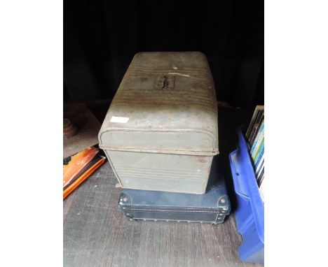 A vintage small suitcase and tin trunk