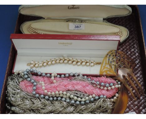 A small selection of costume jewellery including plaited bead necklaces, hair comb, Lotus pearls etc