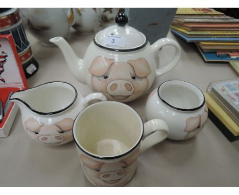 A modern Arthur wood teapot, cream jug, sucre and mug, pig decoration