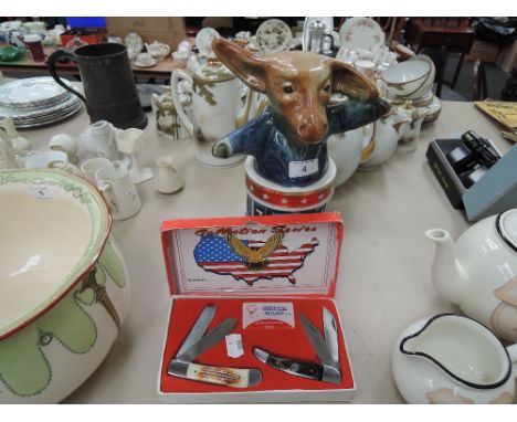 Two US American collectables, comprising boxed pen knife set and a democrat Bourbon decanter