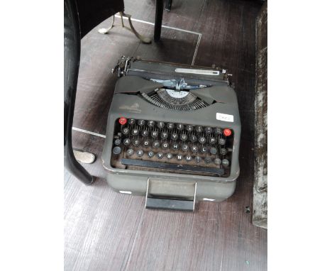 A vintage Aristocat typewriter in case, possibly military issue