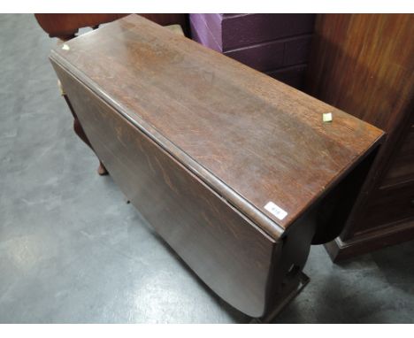 A mid 20th Century oak gate leg dining table