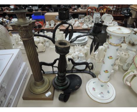 A selection of candlesticks incluing Mintons ceramic, brass Corinthian candlestick and wrought iron having equine theme