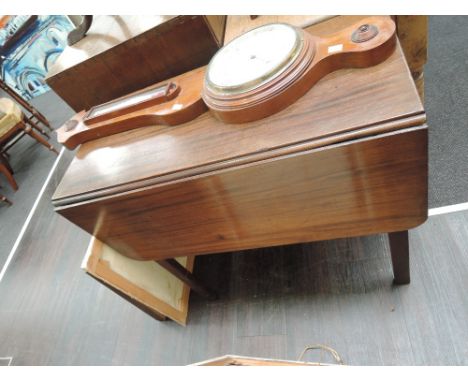 A 19th century mahogany square drop leaf dining table on square gate legs