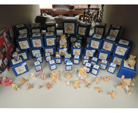 A large collection of ceramic teddy bears