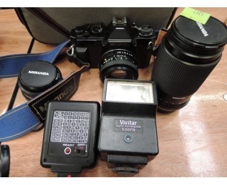 A Miranda 145-1 camera, various Miranda lenses, flash guns and bag etc