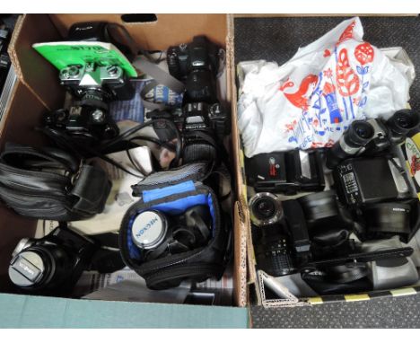 Two boxes of cameras, an Minolta Dynax 300si camera, a Lumix 12x camera, a Fujica ST705 camera, a Pentax, a Cosina, a Megxon 