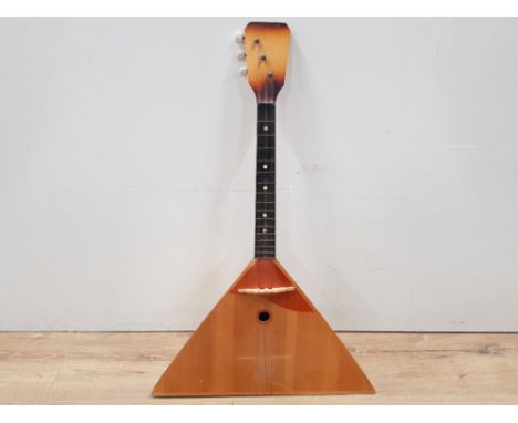 A VINTAGE RUSSIAN BALALAIKA STRINGED MUSICAL INSTRUMENT