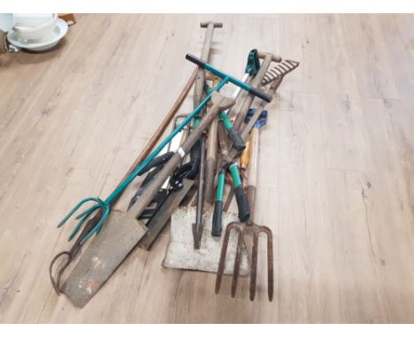 A BUNDLE OF ASSORTED TOOLS IN SAWS SHOVEL CROW BAR ETC