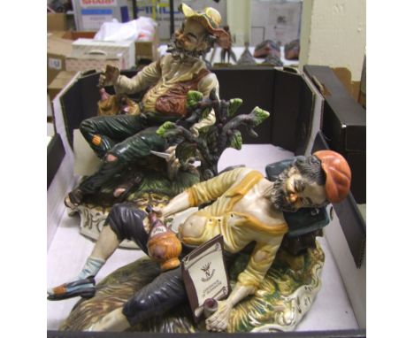 Two Capodimonte figures to include a tramp on a bench and a drunken tramp (1)