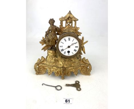 Brass figural mantle clock with pendulum and key, working. No back plate or glass on face. 10.5" high