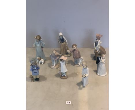 7 Nao figures, 1 Lladro figure and 1 Nadal figure