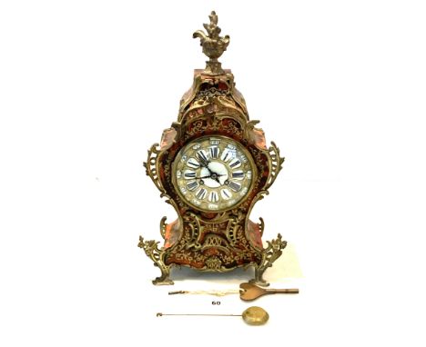 French mantle clock with shaped red lacquered case, enamel dial, figural finial and boule inlay, marked Samuel Marti, Medaill