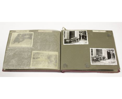 German WW2 photo album with forty eight army photos, portraits and groups, some taken in the snow  