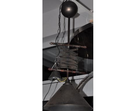 A vintage style telescopic rise and fall metal ceiling light
