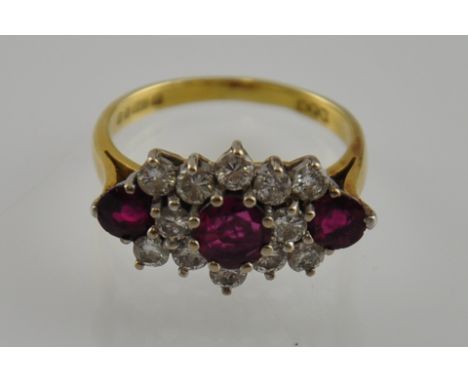 An 18ct gold diamond and ruby ring