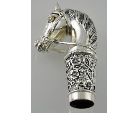 A silver plated horse shaped walking stick topper