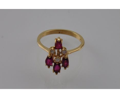 A 14 carat diamond and ruby spray cocktail ring