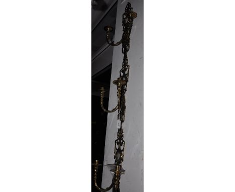 A set of three Victorian style cast brass two branch electric wall light inset faux porcelain panels