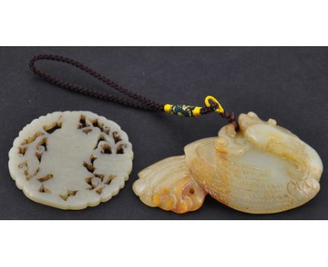 A Chinese carved jade pendant together with another similar