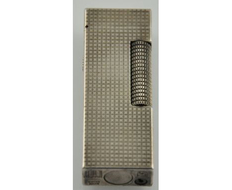 A Dunhill Rolagas silver-plated lighter, with engine-turned body, H. 6.5cm.