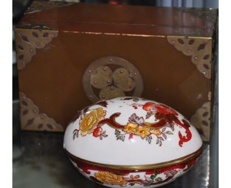A Mason porcelain egg shaped trinket box together with a brass mounted lacquer cigarette box