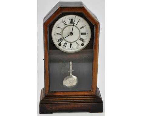 A late 19th/ early 20th Century American glazed mahogany cased mantle clock, the circular white enamel dial marked Roman Nume