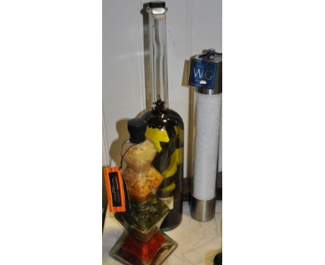 Two decorative oil jars together with a large salt grinder