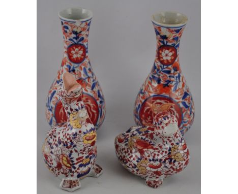 A pair of Imari baluster shaped vases, H. 17.5cm, together with two ceramic duck figures decorated in the same palette (4)