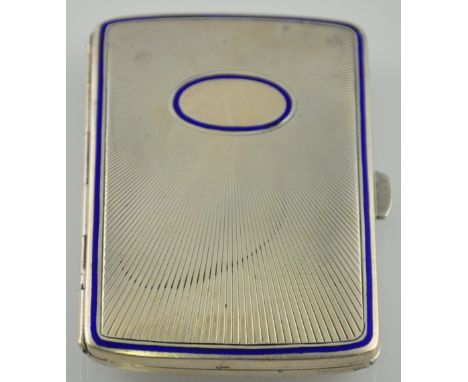 An early 20th century continental 900 standard silver and blue enamel cigarette case. The engine turned body with embossed st