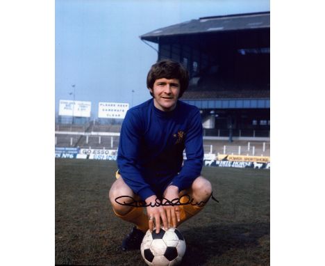 John Hollins signed 10x8 inch colour photo pictured during his playing days with Chelsea. Good condition. All autographs come