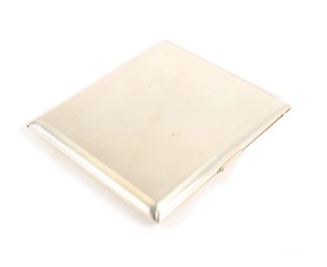 A silver rectangular cigarette case by Asprey, the exterior engine turned, the interior gilt, with engraved inscription, Birm