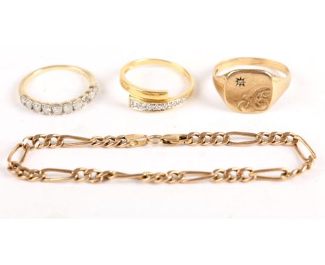 Small collection of gold jewellery. An 18ct gold ring set with seven diamonds, total weight 2.3g; a 10 ct gold ring set with 