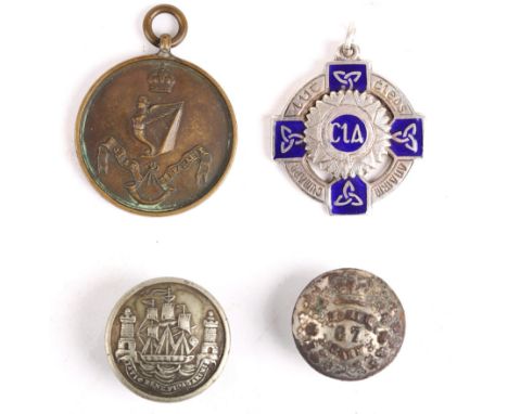 Irish militaria, a Victorian tunic button of the 87 South Cork Militia; a Royal Irish Rifles bronze musketry medal; an Óglaig