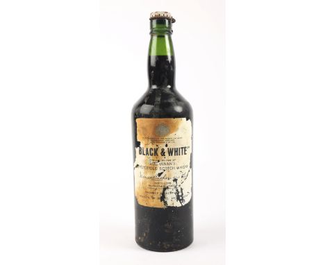 Whiskey. Black &amp; White, Choice Old Scotch Whisky, Buchanans, 1950s spring cap bottling, 70 proof, 26 2/3 fl. oz, one bott