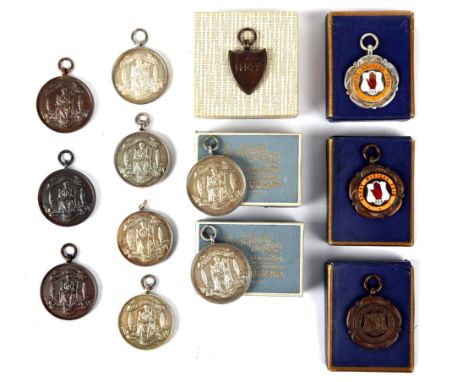 Newry Musical Feis, 1930-35 thirteen prize medals. Seven silver medals, makers' marks for Arthur Fenwick, Thomas Fattorini an