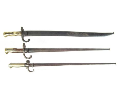 Three French Bayonets and scabbards, to fit a M.1866 Chassepot with matching serial numbers, M.1873 Gras and a M.1886 Lebel r
