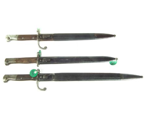 Three bayonets and scabbards, to include:Brazilian M.1908 probably made by Czechoslovakia however there are no export marks, 