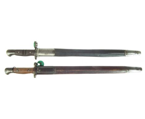 Two bayonets and scabbards, to include:Pattern 1913 made in the USA for Britain, left ricasso stamped with model number 1913 