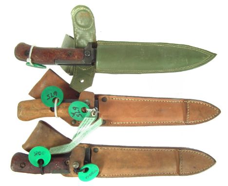 Three Czech Vz58 bayonets and scabbards.The first with long tang, pointed crossguard and two rivets grip, serial number 04S20