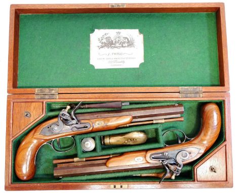 Modern Cased pair of deactivated flintlock pistols, stamped with the name Twigg, with 10 inch 12mm calibre barrels, the case 