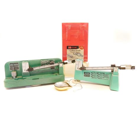 Two RCBS scales and an unopened set of Hornady Custom Grade .243 dies.