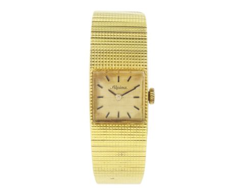 Alpina 18ct gold manual wind wristwatch, champagne dial with baton hour markers, Helvetia hallmark, on integral 18ct gold bra