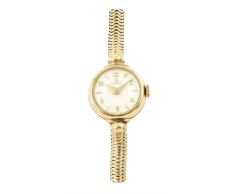 Omega ladies manual wind wristwatch, Cal. 244, silvered dial with dagger and Arabic numerals, on integral 9ct gold bracelet, 